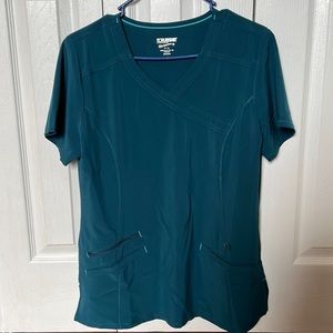 Olive green/blue scrubs. Size small top and x-small bottoms.